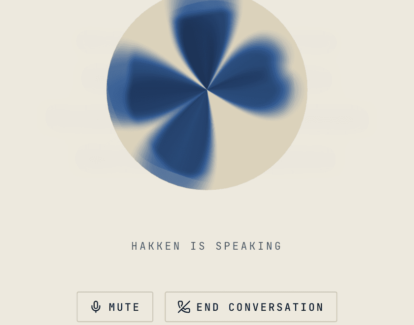 The voice interview: the indigo orb, 'Hakken is speaking', and Mute / End conversation controls.